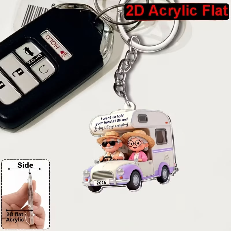 Camping couple 2D keyring with their motorhome in 2 colour options.