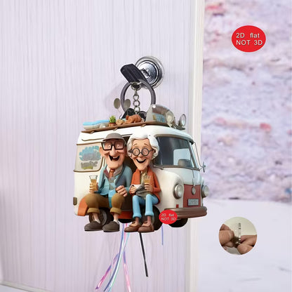 Camping couple 2D keyring with their camper van