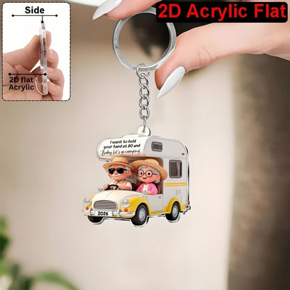 Camping couple 2D keyring with their motorhome in 2 colour options.